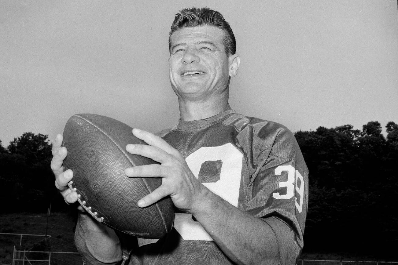 FILE -  York Giants  Halfback Hugh McElhenny, poses at the team's NFL football training camp in Fairfield, Conn., on Sept. 3, 1963. McElhenny, an elusive NFL running back nicknamed “The King,” died on June 17, 2022, at his home in Nevada, his son-in-law Chris Permann confirmed Thursday, June 23, 2022. He was 93. (AP Photo/Harry Harris, File)