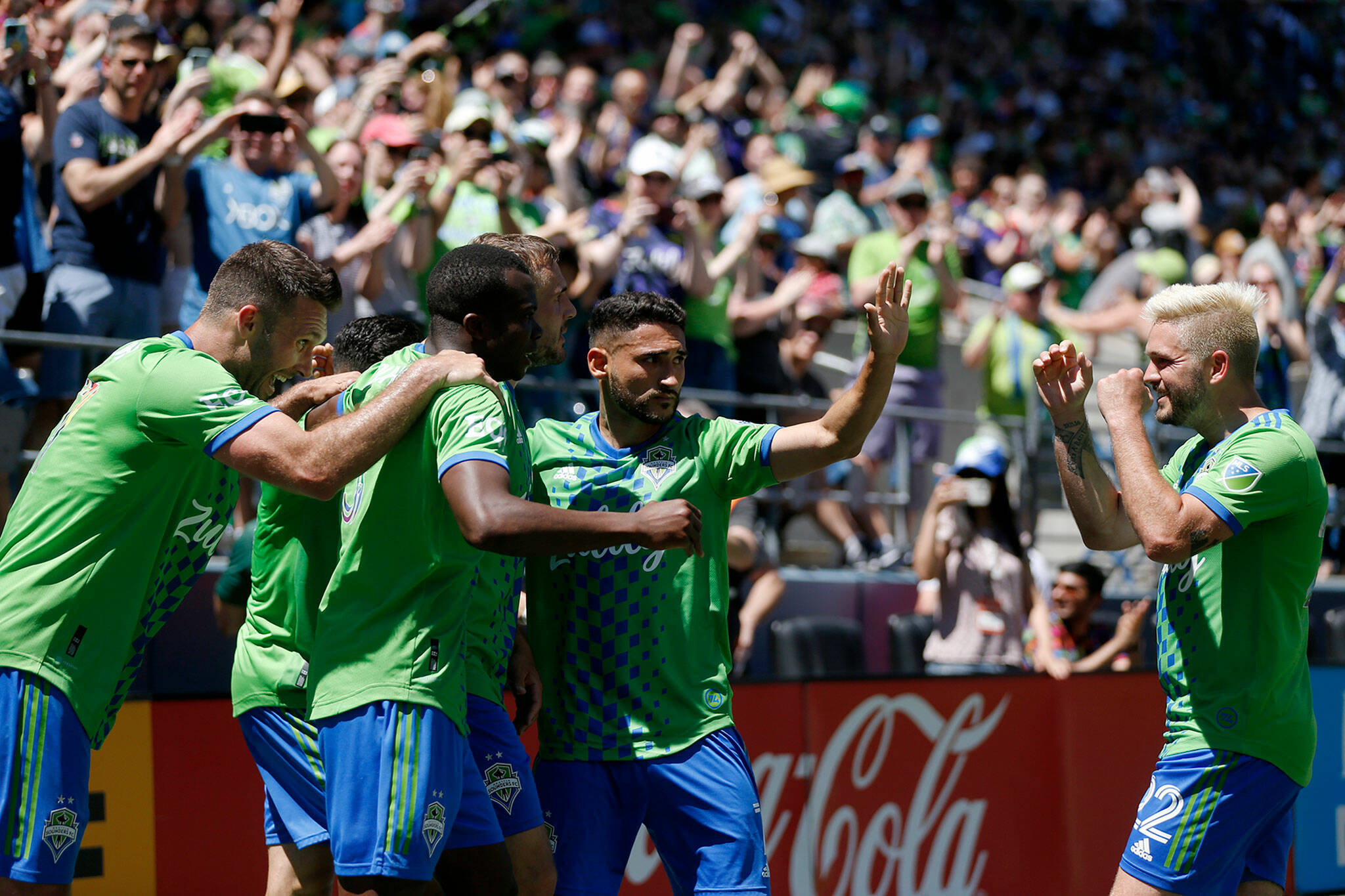 The Seattle Sounders celebrate Jordan Morris’s second half goal against Sporting KC on Saturday, June 25, 2022, at Lumen Field in Seattle, Washington. (Ryan Berry / The Herald)