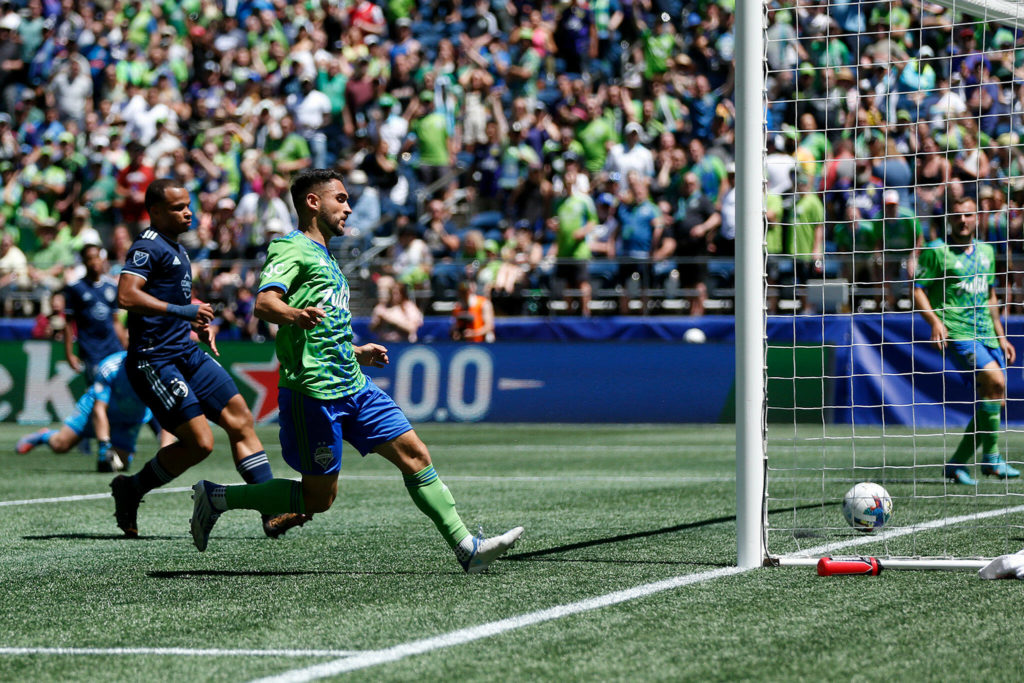 The Seattle Sounders’ Cristian Roldan taps in the third and final goal of the game for Seattle against Sporting KC on Saturday, June 25, 2022, at Lumen Field in Seattle, Washington. (Ryan Berry / The Herald)
