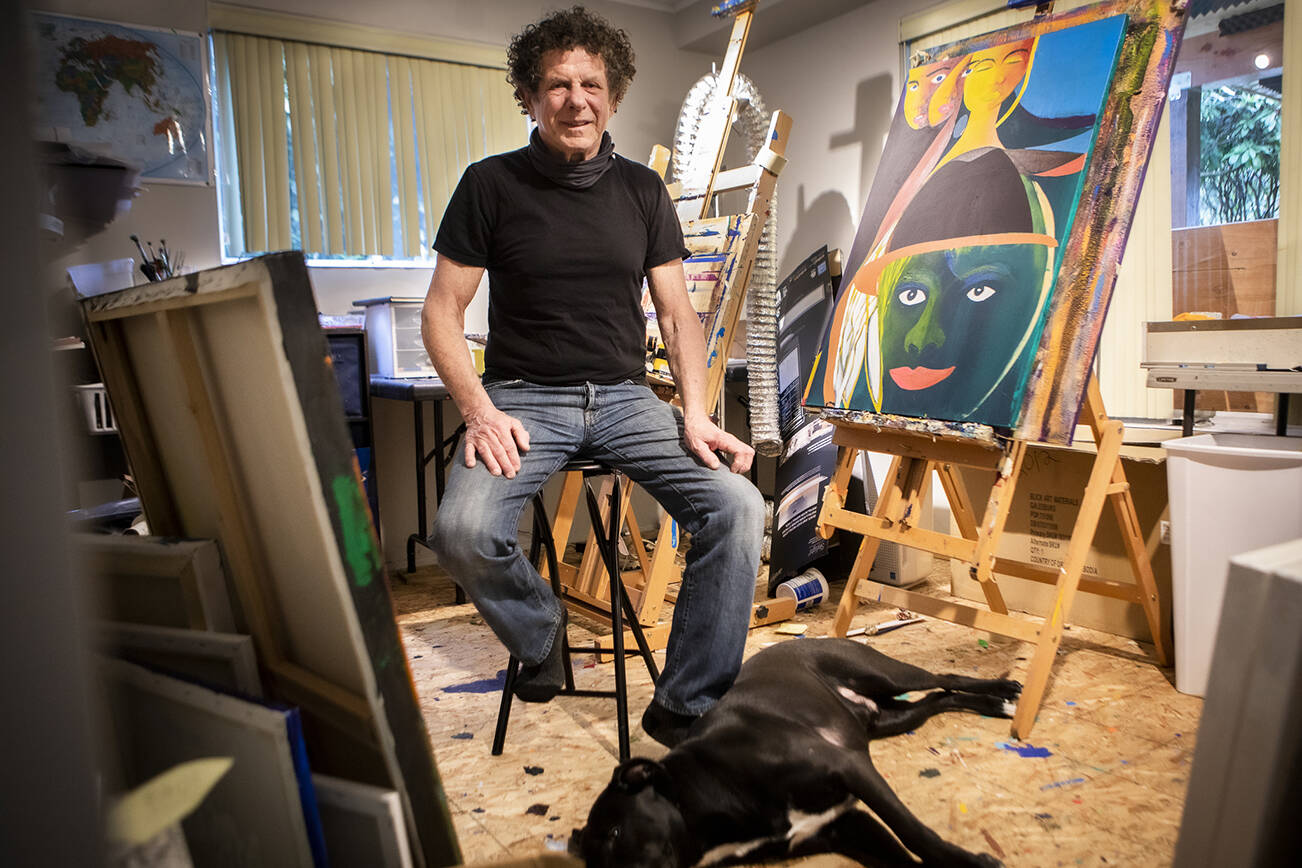 Lee Oskar and his dog Tex inside his art studio in his home on Wednesday, March 2, 2022 in Everett, Washington. (Olivia Vanni / The Herald)