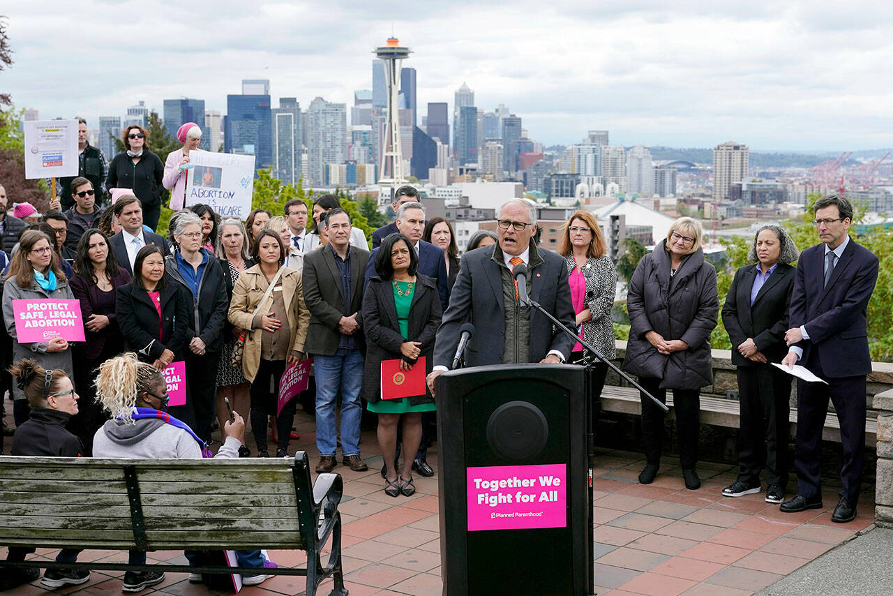 Washington Gov. Jay Inslee speaks Tuesday at a rally at a park overlooking Seattle. Inslee said that Washington would remain a pro-choice state and that women would continue to be able to access safe and affordable abortions. (AP Photo/Ted S. Warren)