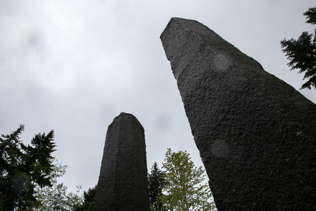 Two pillars of a stone circle tower over guests at Earth Sanctuary. (Ryan Berry / The Herald)
