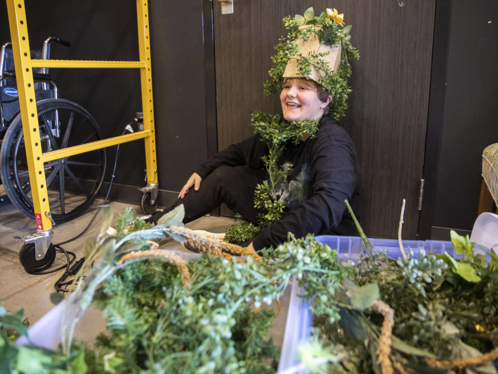 Ayvah Lee smiles while working on foliage themed costumes during a theater summer class on July 7, in Marysville. (Olivia Vanni / The Herald)

