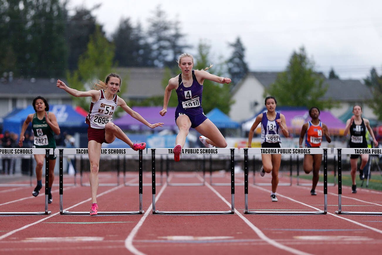 Lake Stevens’ Chloe Pattison falls just behind in the final moments of the 4A girls 300 hurdles Saturday, May 28, 2022, at the 2022 WIAA State Track & Field Championships at Mount Tahoma High School in Tacoma, Washington. (Ryan Berry / The Herald)