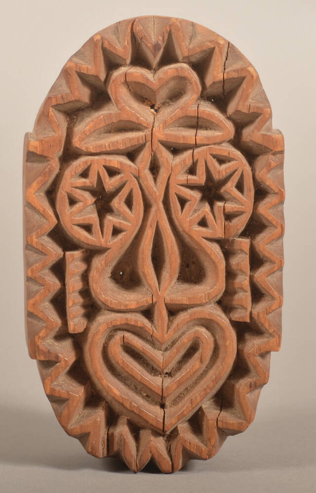 Butter prints like this one pressed a design into freshly made butter as a decoration or for marketing. Today, collectors search for antique butter prints and consider them folk art.