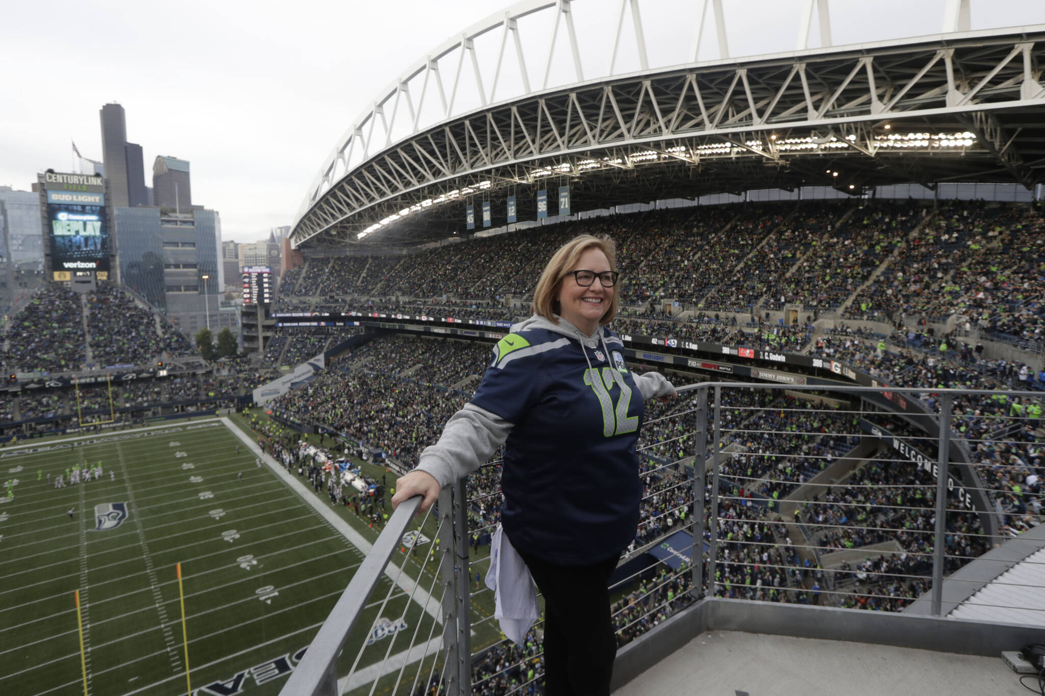 Seahawks owner Jody Allen stands on a balcony at CenturyLink Field after she raised the 12th man flag before the team’s game against the Los Angeles Rams on Oct. 3, 2019, in Seattle. (AP Photo/Stephen Brashear)