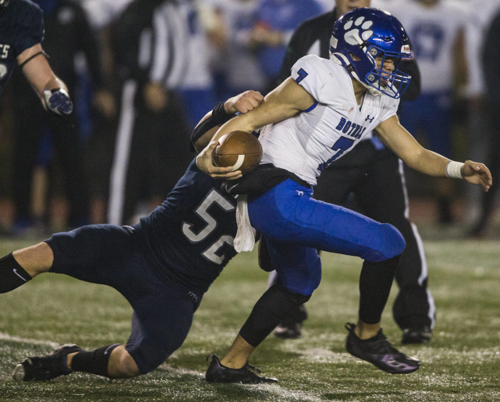 Glacier Peak’s Jacob Erickson tackles a Bothell player during a game on Nov. 12, 2021 in Snohomish. (Olivia Vanni / The Herald)
