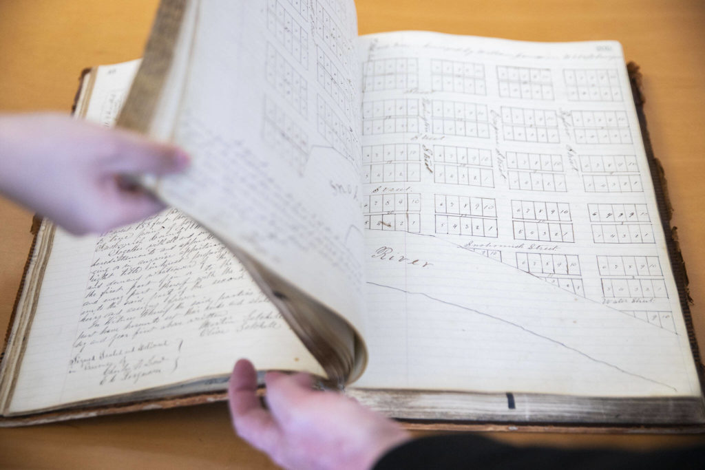 A map of land plots along the Snohomish River inside Book 1 of the Snohomish County Deeds records on Tuesday, in Everett. (Olivia Vanni / The Herald)
