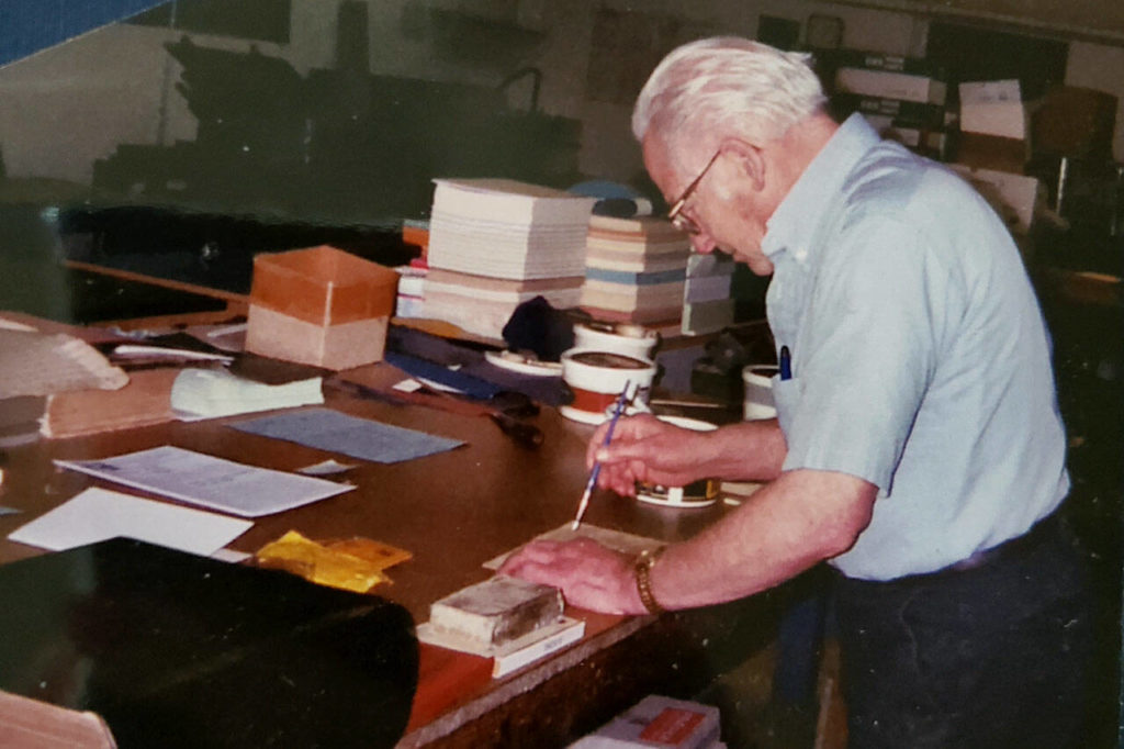 The late book binder Roy Gerrard is pictured here working on a repair project in his shop in Everett. Gerrard helped bind and repair record books for Snohomish County. (Courtesy of Jennifer Gerrard) 
