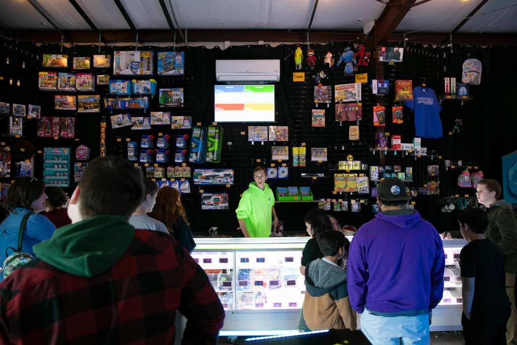People line up to get their prizes at the arcade at the Blue Fox Drive-In Theater. (Ryan Berry / The Herald)
