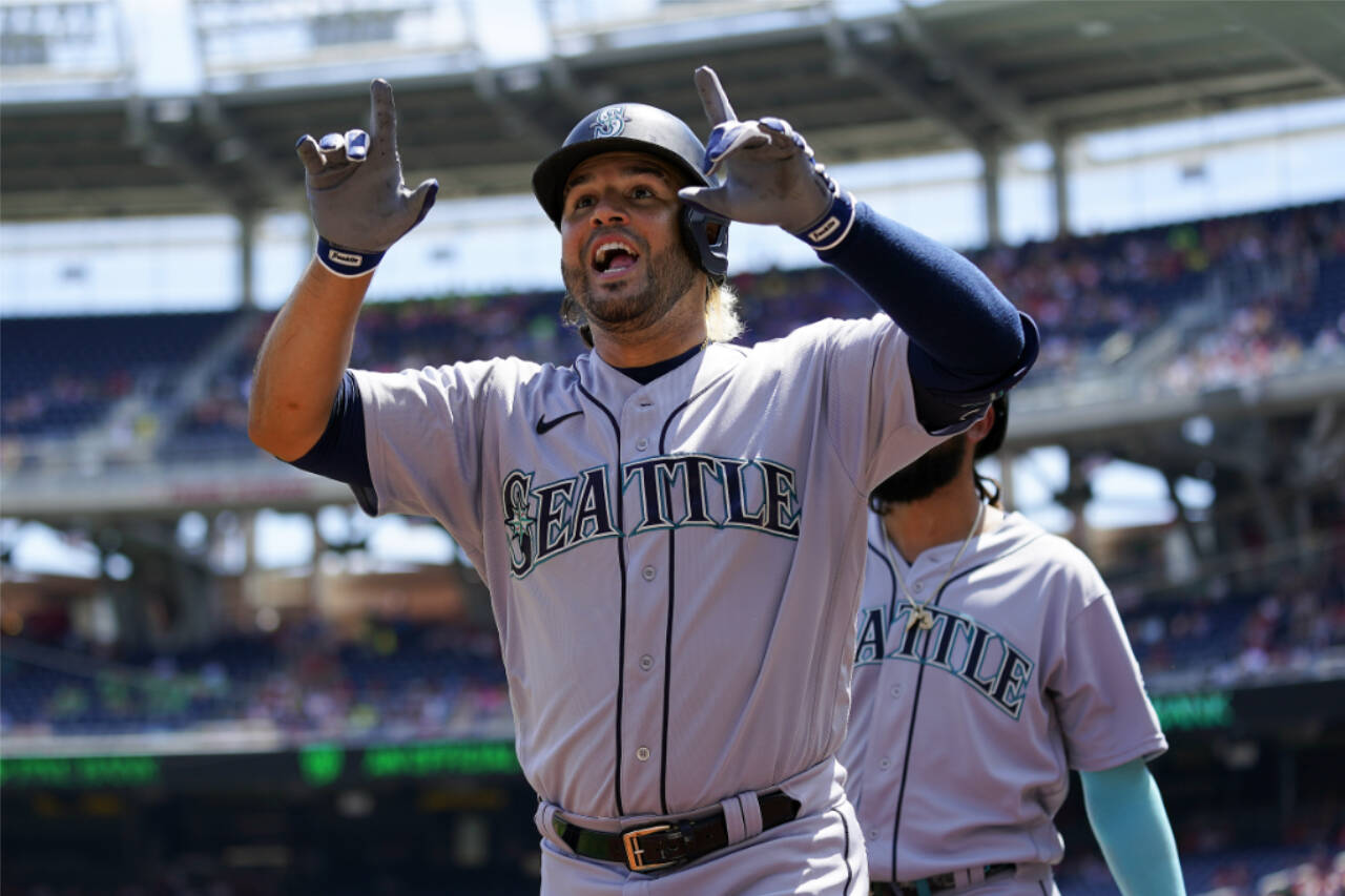 Seattle Mariners’ Eugenio Suarez reacts after hitting a three-run home run in the first inning of the first game of a doubleheader against the Washington Nationals on Wednesday in Washington. (AP Photo/Patrick Semansky)