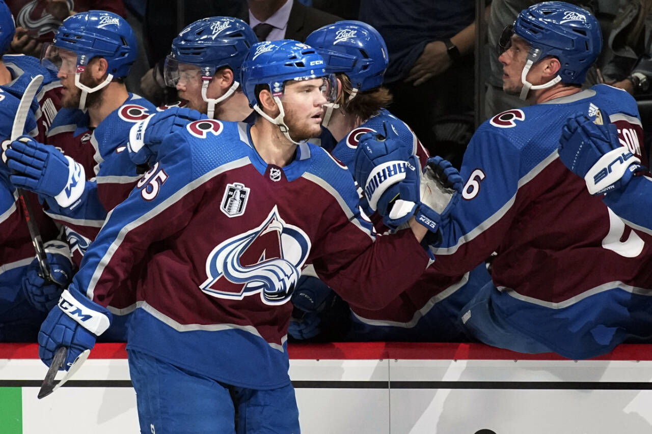 Colorado Avalanche left wing Andre Burakovsky is congratulated for his goal against the Tampa Bay Lightning during Game 2 of the Stanley Cup Final on June 18 in Denver. Burakovsky signed a five-year deal with the Seattle Kraken on Wednesday. (AP Photo/John Locher)