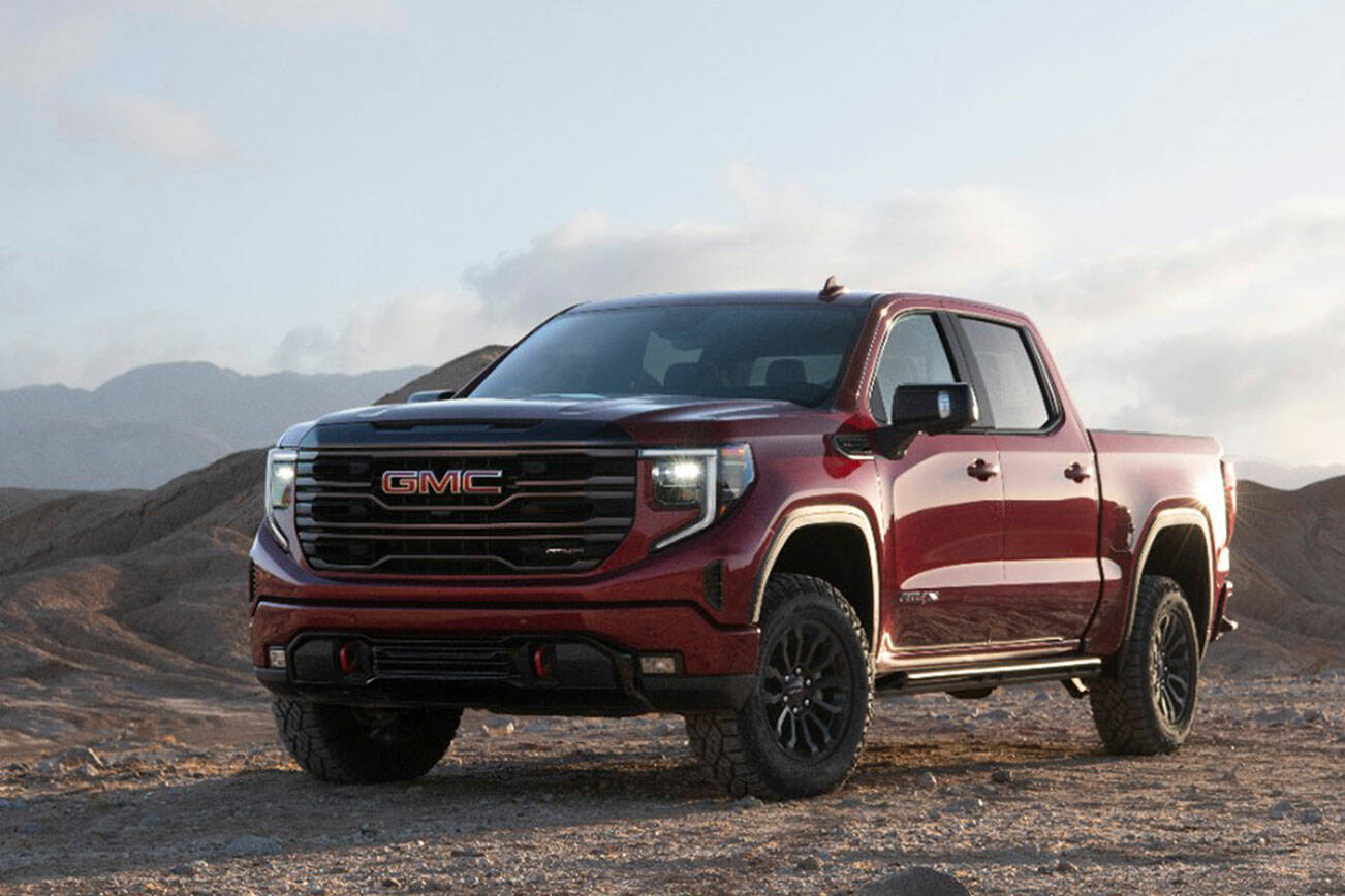The GMC Sierra 1500 AT4X rolls on burly mud-terrain tires wrapped around 18-inch black wheels. (GMC)
