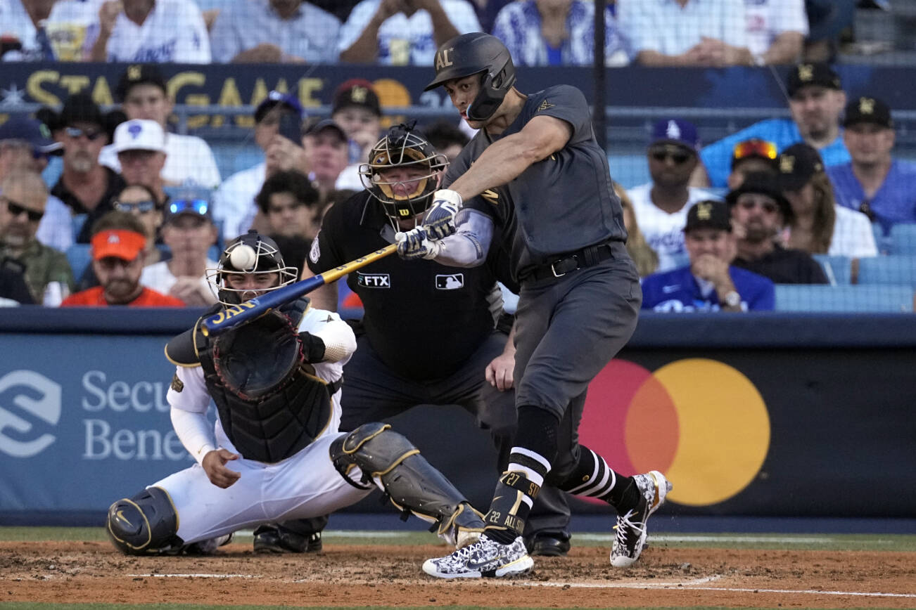 American League's Giancarlo Stanton, of the New York Yankees, connects for a two-run home run during the fourth inning of the MLB All-Star baseball game against the National League, Tuesday, July 19, 2022, in Los Angeles. (AP Photo/Jae C. Hong)