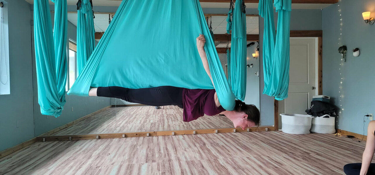 At Flight Room in Lynnwood, aerial fitness poses like “vampire” use every muscle in your body. (Jennifer Bardsley)