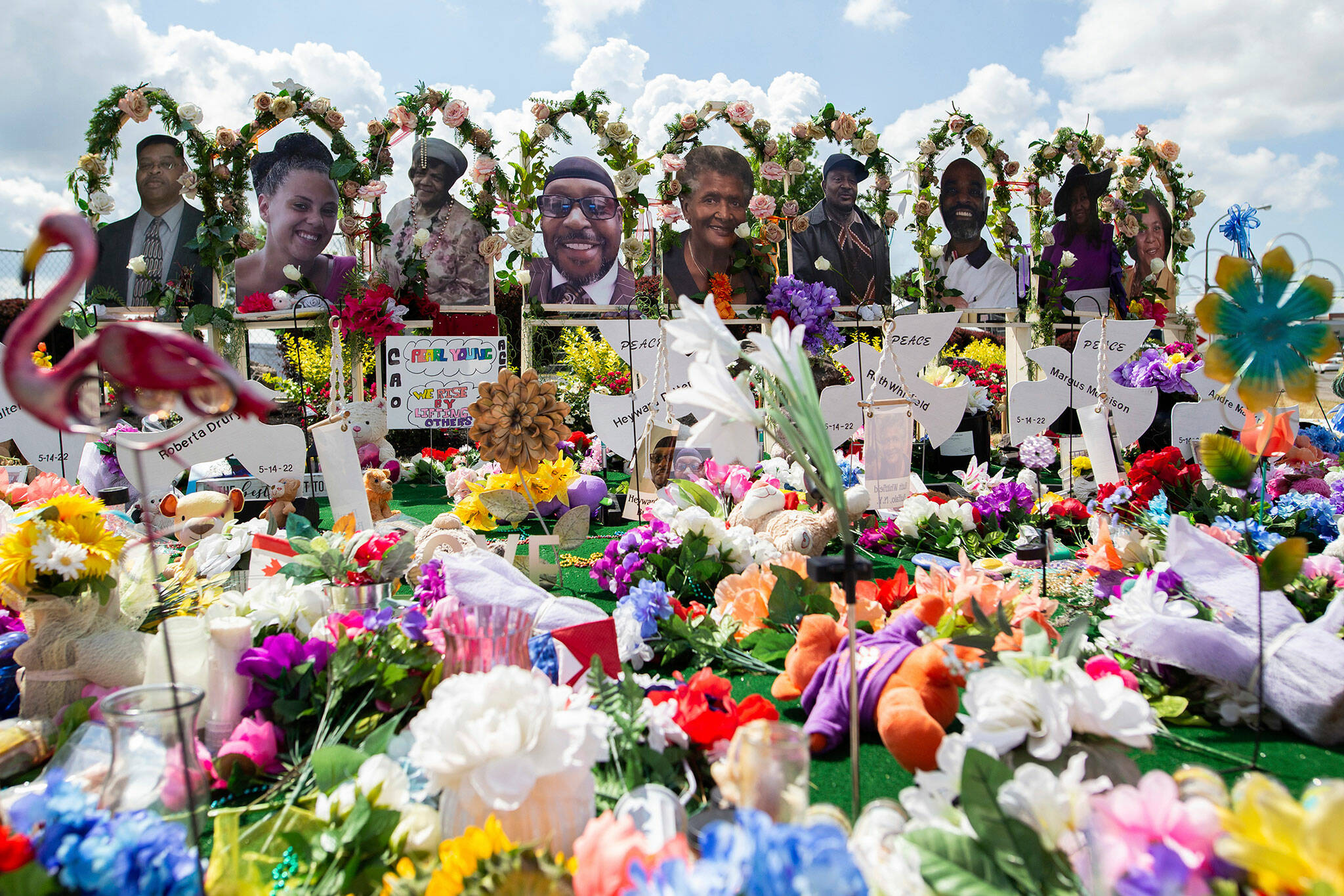 A memorial for the supermarket shooting victims is set up outside the Tops Friendly Market on July 14, in Buffalo, N.Y. The Buffalo supermarket where 10 Black people were killed by a white gunman is set to reopen its doors, two months after the racist attack. (AP Photo / Joshua Bessex)