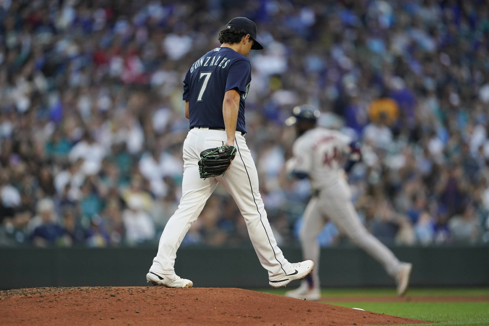 Mariners starting pitcher Marco Gonzales (7) stands on the mound as the Astros’ Yordan Alvarez rounds the bases after hitting a solo home run during the fourth inning of a game Friday in Seattle. (AP Photo/Ted S. Warren)