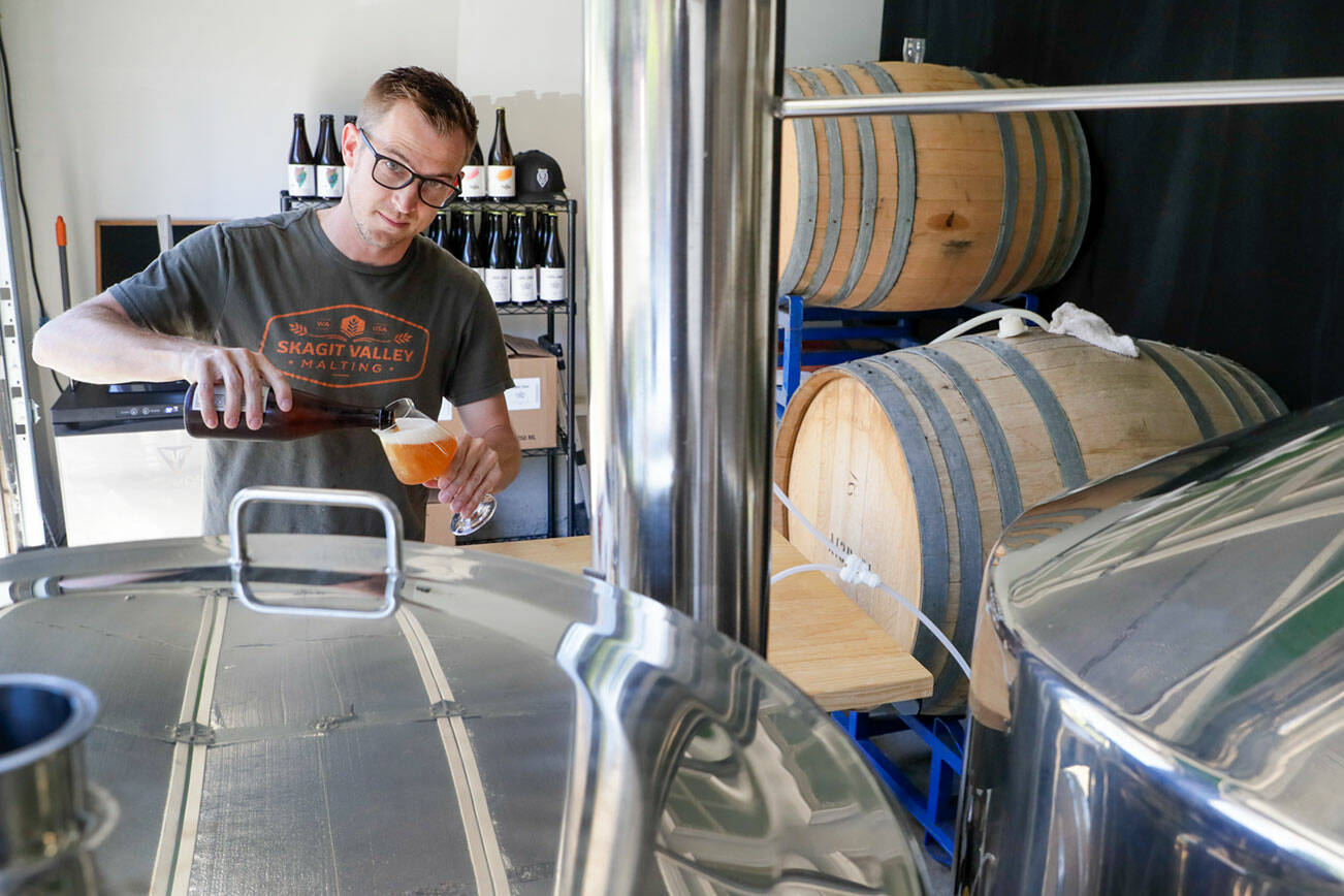 Nick Hegge, brewer and owner of Wild Oak Project, runs a brewery out of his garage in Everett, Washington on July 25, 2022. (Kevin Clark / The Herald)