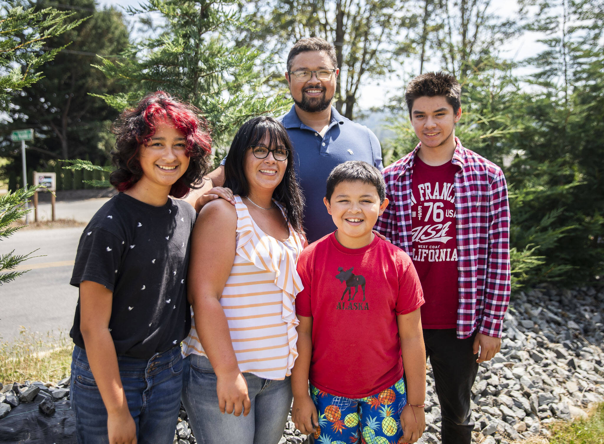 The Norsworthy family outside of their home that is across the street from one of the entrances to Summer Meltdown on Wednesday, in Monroe. (Olivia Vanni / The Herald)