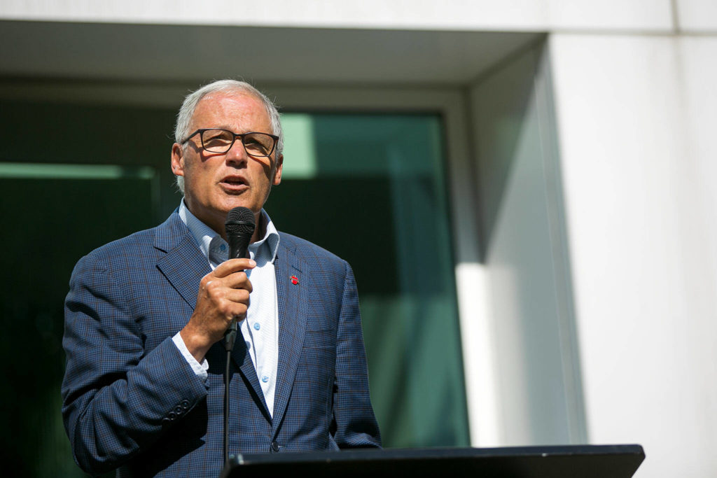 Gov. Jay Inslee speaks about mental health action and the VOA’s Behavioral Health Crisis Call Center during a presser outside of the call center’s office on Thursday, in Everett. (Ryan Berry / The Herald)

