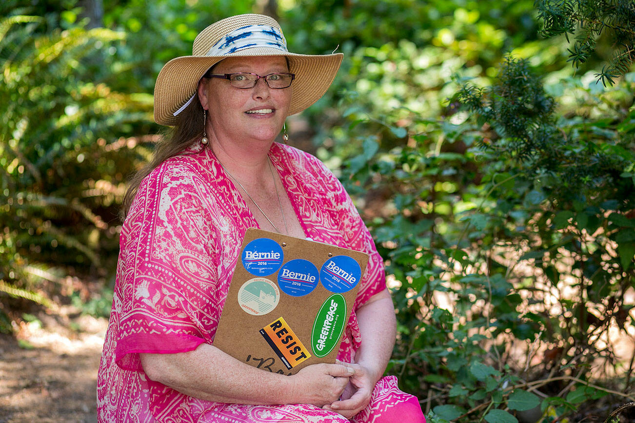 Alabama “'Bama” Nightmare holds her clipboard while sitting for a portrait Wednesday, July 27, 2022, in Everett, Washington. Nightmare is running to be the Democratic candidate for Precinct Committee Officer in her precinct. (Ryan Berry / The Herald)