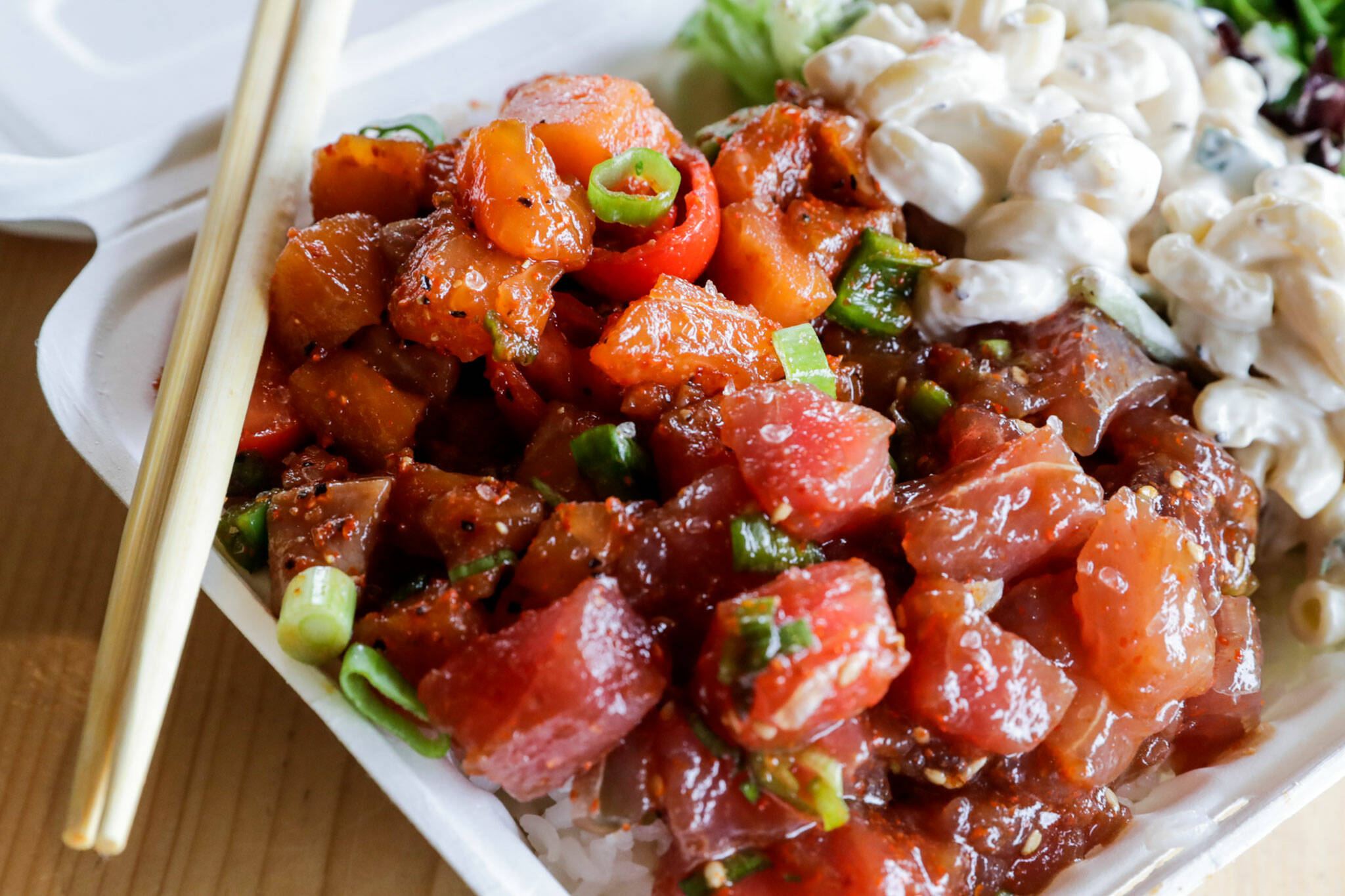 Spicy salmon and spicy sambal ahi on sushi rice with mac salad served with salad June 22 at Ono Poke in Edmonds. (Kevin Clark / The Herald)