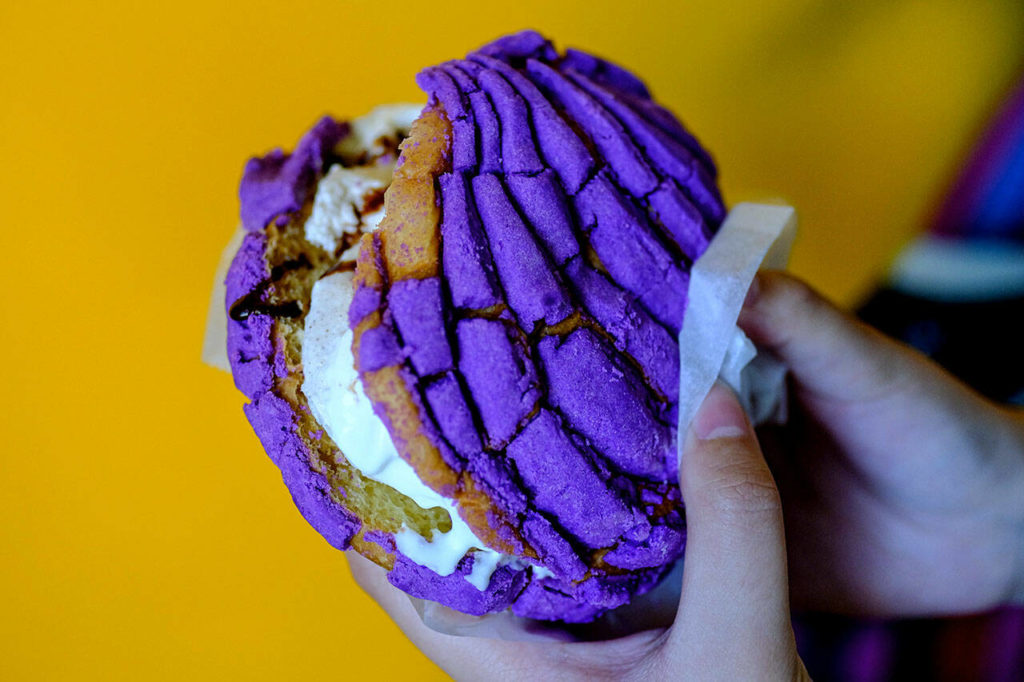 The Conchita at Las Fridas in Everett is an ice cream sandwich in concha form: A sweet Mexican sweet roll is stuffed with ice cream, chocolate sauce and whipped cream. You can also order one with Nutella and fresh strawberries. (Taylor Goebel / The Herald)
