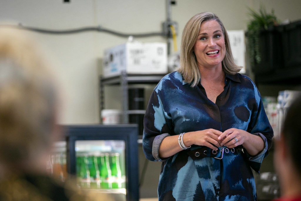Tiffany Smiley, who is running as a Republican for U.S. Senate, speaks to a small group of supporters on July 28, at the Chevron Gas Station on Everett Mall Way in Everett. (Ryan Berry / The Herald)
