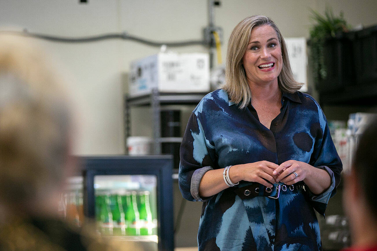 Tiffany Smiley, who is running as a Republican for U.S. Senate, speaks to a small group of supporters Thursday, July 28, 2022, at the Chevron Gas Station on Everett Mall Way in Everett, Washington. (Ryan Berry / The Herald)