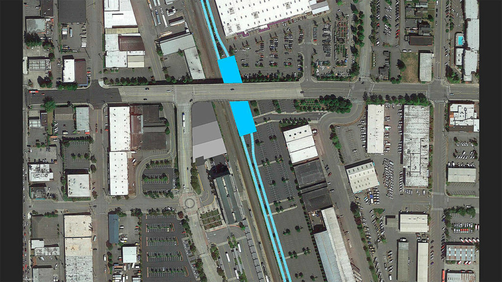 A light rail station under the Pacific Avenue overpass could be elevated so riders can reach the road’s sidewalks and get downtown without crossing the train tracks. (Everett Station District Alliance)
