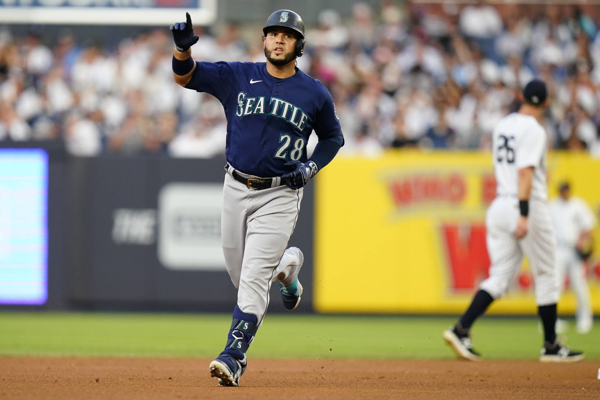 The Mariners’ Eugenio Suarez gestures to fans as he runs the bases after hitting a two-run home run during the first inning of a game against the Yankees on Tuesday in New York. (AP Photo/Frank Franklin II)