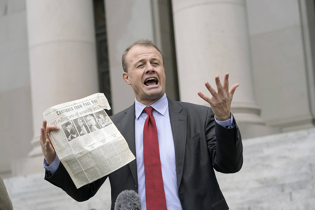Tim Eyman talks to reporters on Oct. 15, 2020, in front of the Temple of Justice at the Capitol in Olympia. (AP Photo / Ted S. Warren)