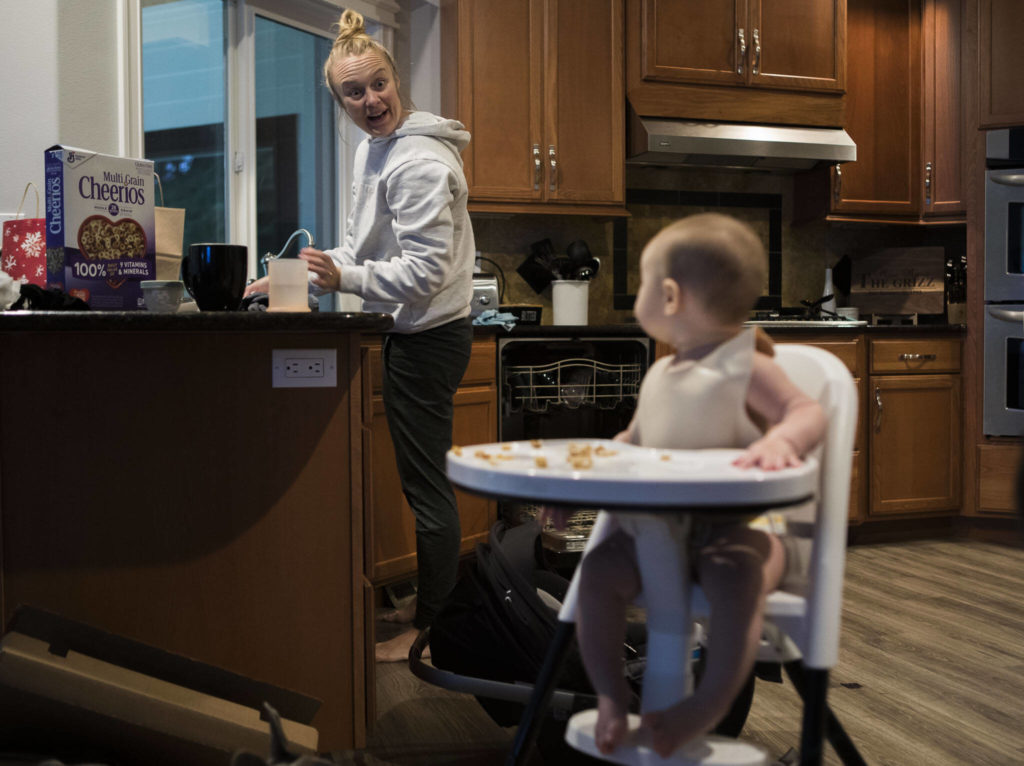 Making breakfast at home, Miranda Granger makes a funny face at her daughter Austin on Monday, Feb. 28, 2022, in Lake Stevens, Washington. (Olivia Vanni / The Herald)
