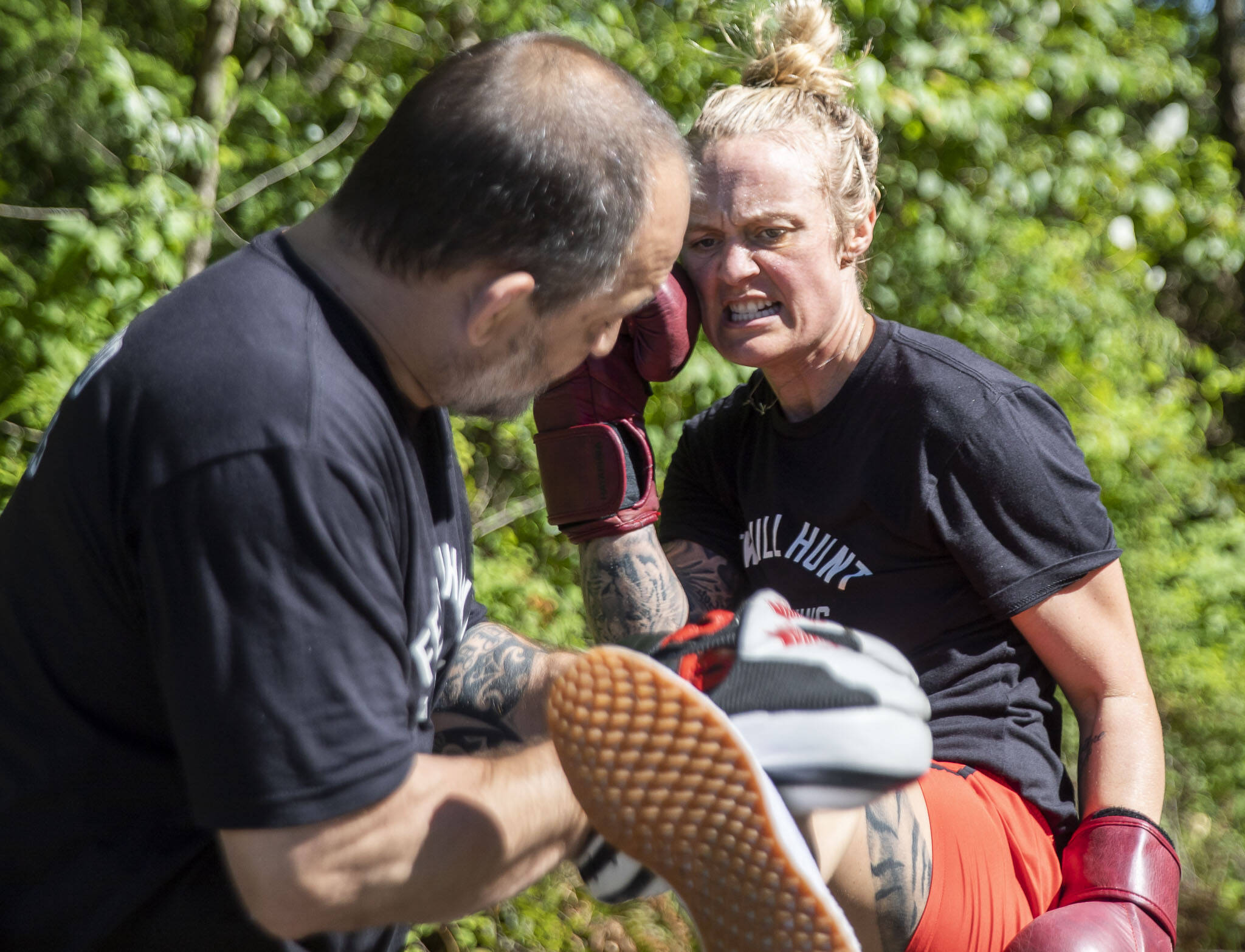 Scowling, Miranda Granger hits a round kick in one of her final training sessions on Tuesday, July 12, 2022, weeks before she headed to Las Vegas for a UFC fight. (Olivia Vanni / The Herald)