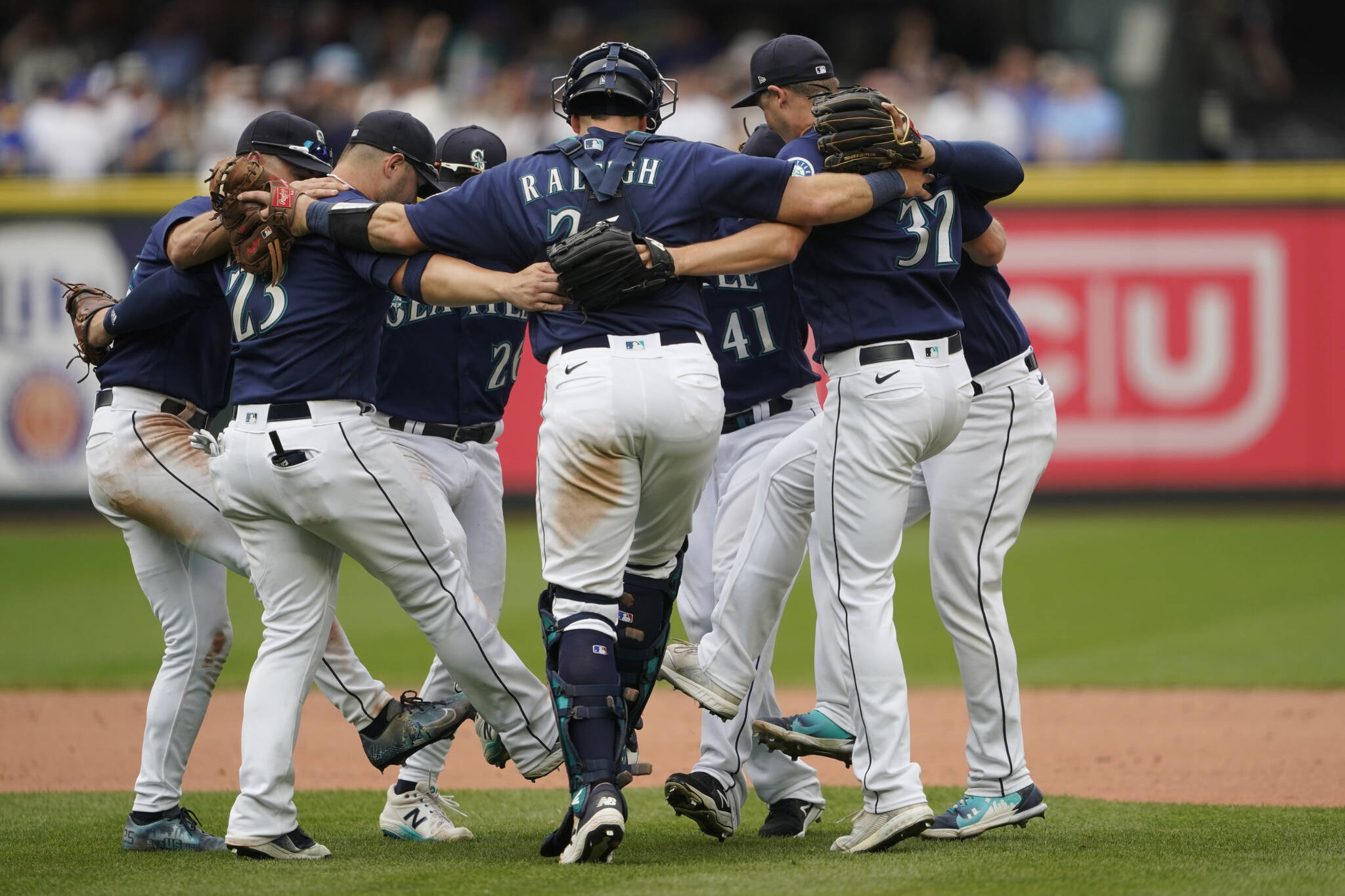 Mariners players dance as they celebrate their 4-3 win over the Yankees on Wednesday at T-Mobile Park in Seattle. (AP Photo/Ted S. Warren)