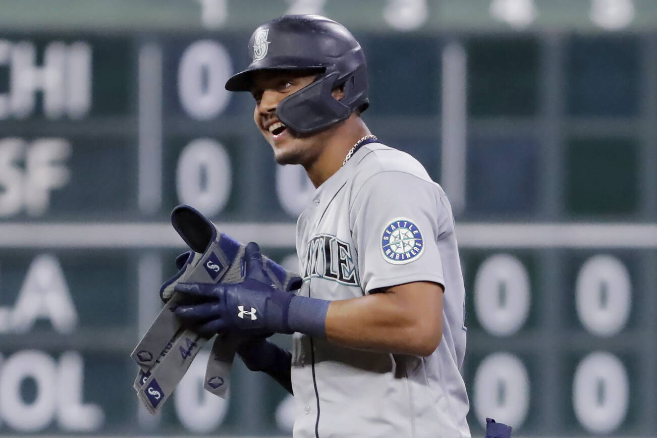 Seattle Mariners Julio Rodriguez after his one run RBI double against the Houston Astros during the eighth inning of a baseball game Friday, July 29, 2022, in Houston. (AP Photo/Michael Wyke)