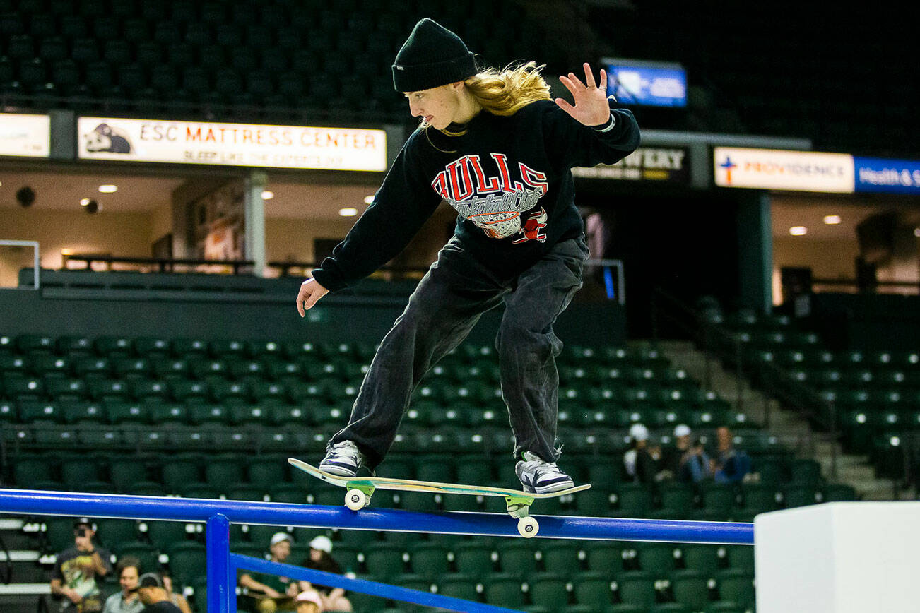 Poe Pinson railslides during a warm up before the start of the Street League Skateboarding women’s final on Sunday, Aug. 14, 2022 in Everett, Washington. (Olivia Vanni / The Herald)