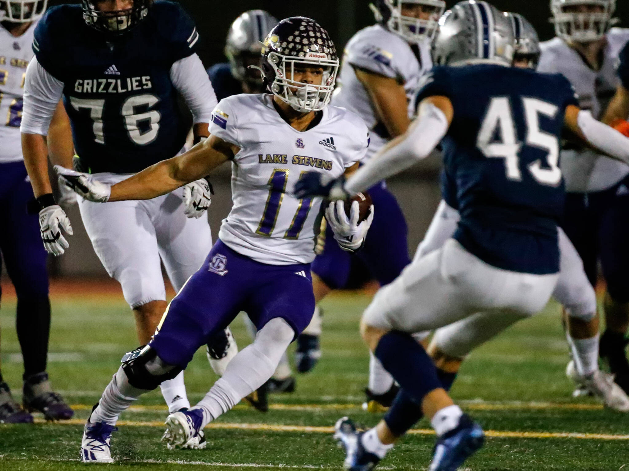 Lake Stevens’ Jayden Limar runs with the ball during a game against Glacier Peak at Veterans Memorial Stadium in Snohomish on Oct. 29, 2021. (Kevin Clark / The Herald)