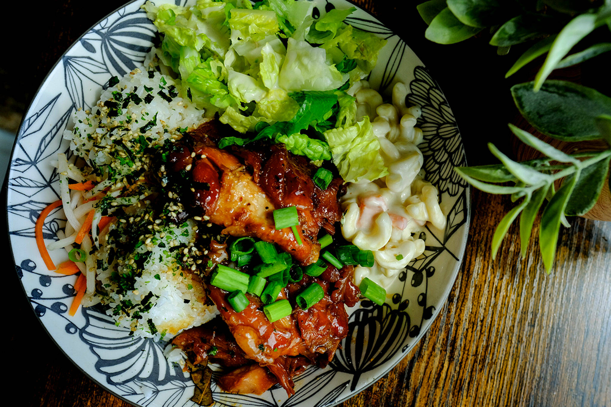 Enseamada, a new Filipino cafe in Everett, serves up generous plates like their adobo bowl, with soy garlic chicken, mac salad, rice and dressed lettuce. They also offer coffee drinks, halo halo and their must-have ensaymadas. (Taylor Goebel / The Herald)