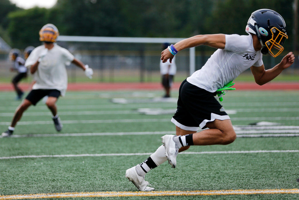 Mariner senior Mackey James turns and runs upfield during a drill. (Ryan Berry / The Herald)
