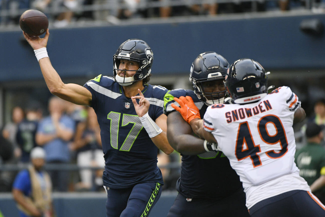 Seattle Seahawks quarterback Jacob Eason (17) passes during the first half of a preseason NFL football game against the Chicago Bears, Thursday, Aug. 18, 2022, in Seattle. (AP Photo/Caean Couto)