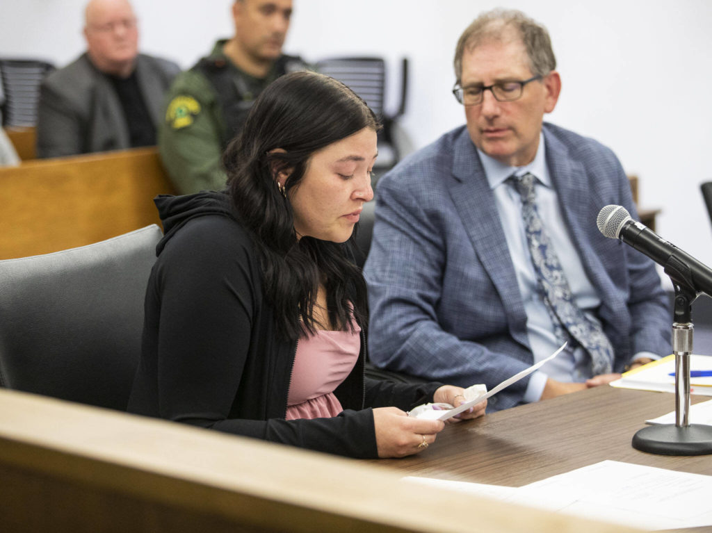 Taylor Allen, girlfriend to Daniel Brakke, reads a statement to the court during the sentencing of Daniel Rodrigues at the Snohomish County Courthouse on Wednesday, in Everett. (Olivia Vanni / The Herald) 
