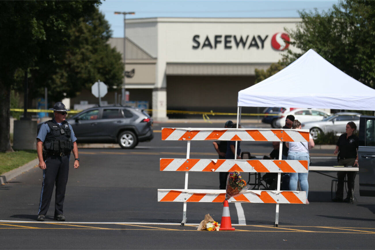 The Forum Shopping Center in Bend, Ore. remained closed Monday, Aug. 29, 2022 as police investigated a shooting at the Safeway there that left two people and the suspected gunman dead Sunday night. (Dave Killen/The Oregonian via AP)