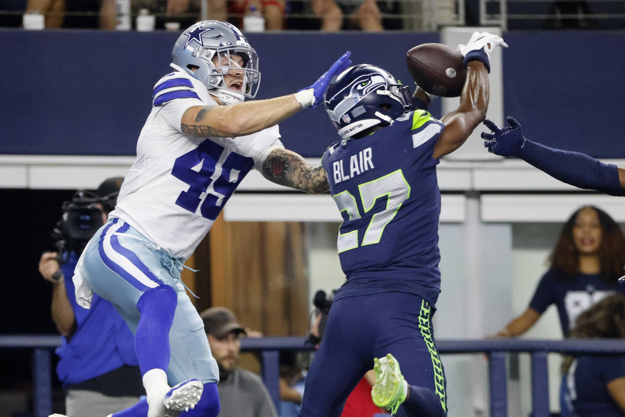 Seahawks safety Marquise Blair (27) breaks up a pass intended for Cowboys tight end Peyton Hendershot in the end zone in the first half of a preseason game on Aug. 26, 2022, in Arlington, Texas. (AP Photo/Michael Ainsworth)