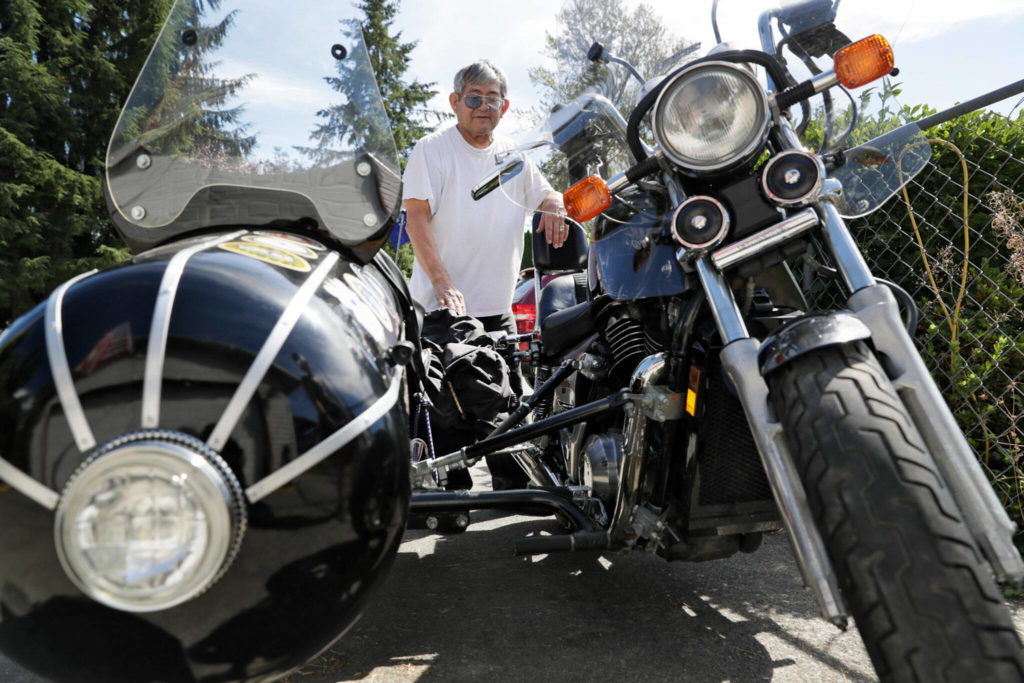 Walt Jackson, a Granite Falls veteran, has attached a sidecar to his Honda Shadow which allows his wife, who suffered a stroke, to ride along. Photographed Aug. 16, in Granite Falls. (Kevin Clark / The Herald)
