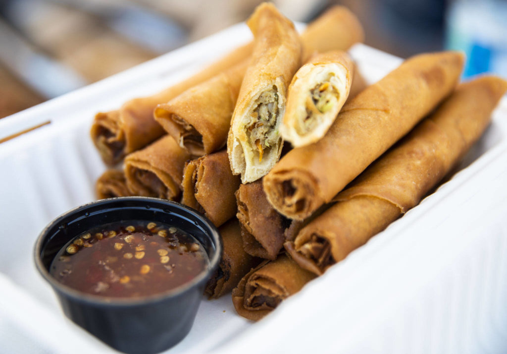 Wrap ’n’ Roll’s lumpia with a sweet and spicy chili sauce at the Monroe Farmers Market. (Olivia Vanni / The Herald)
