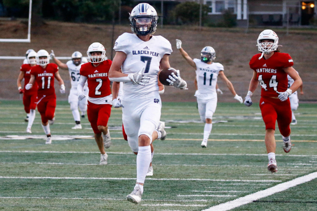 Glacier Peak’s Logan Szarzec outruns the Snohomish defense for a touchdown during a game at Veterans Memorial Stadium in Snohomish on Sept. 3, 2021. The Grizzlies and Panthers meet in the 11th edition of the Dick Armstrong Gup on Friday. (Kevin Clark / The Herald)
