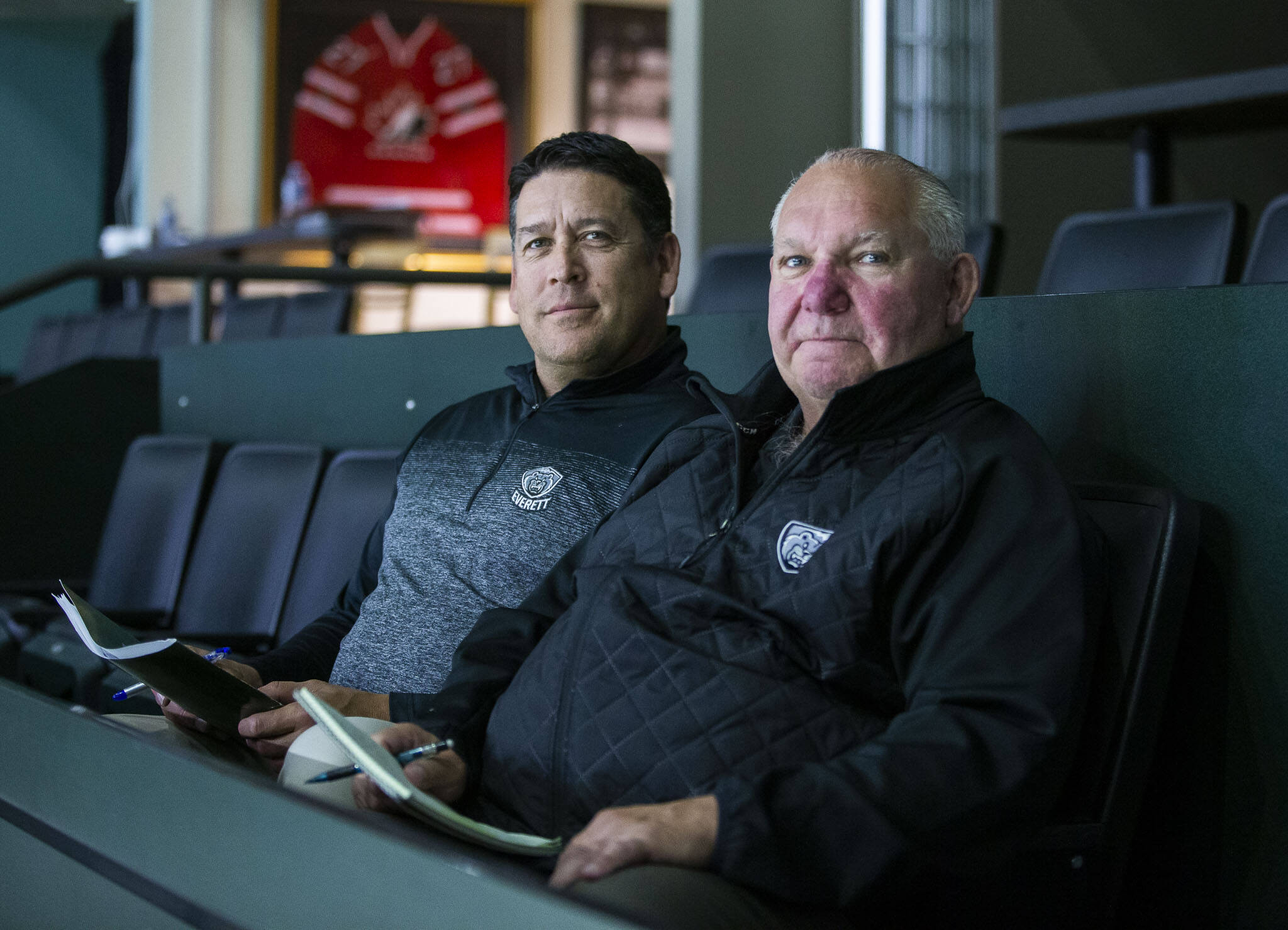 Silvertips scouts Doug Sinclair (left) and Garry Ryhorchuk have been with the Everett organization all 20 years of its existence. (Olivia Vanni / The Herald)