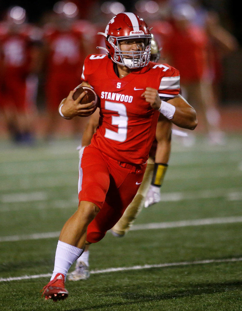 Stanwood’s Wyatt Custer heads for the open field against Lakewood on Friday, Sep. 2, 2022, at Lakewood High School in Arlington, Washington. (Ryan Berry / The Herald)
