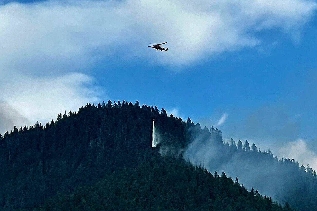 A helicopter drops water on one of three wildfires burning east of Darrington. (Mt. Baker-Snoqualmie National Forest - US Forest Service)